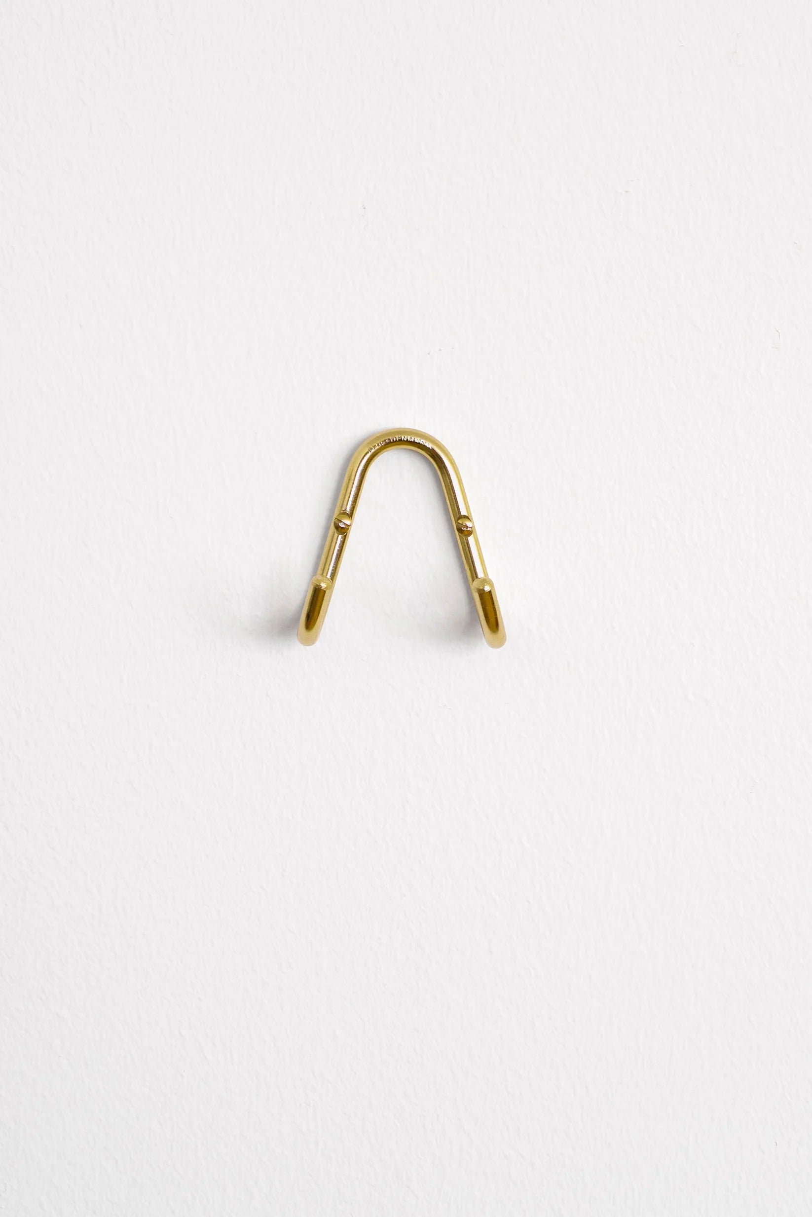 Symmetrisk dobbeltknage / poleret messing